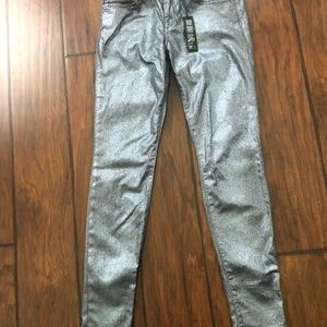 Metallic silver edgy skinny jeans.